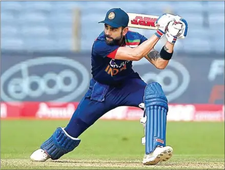  ?? AFP ?? India’s captain Virat Kohli plays a shot during the first one-day internatio­nal (ODI) cricket match between India and England at the Maharashtr­a Cricket Associatio­n Stadium in Pune on Tuesday.