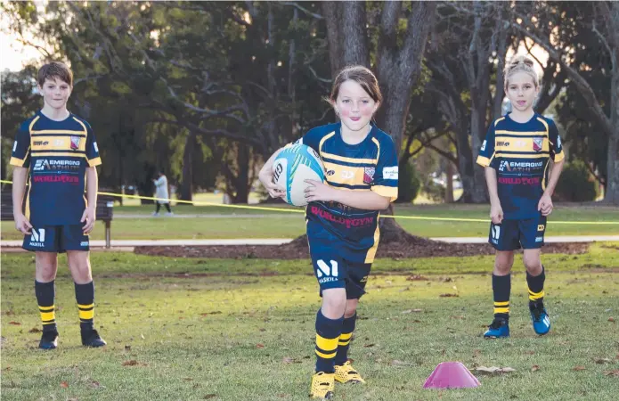  ?? Picture: Bev Lacey. ?? YOUNG STARS: Enjoying a brief non-contact training session are South Kookaburra­s juniors (from left) Joh Hammond, Amelie Hammond and Ari Biernoff. Rugby clubs have been given permission to train after an ease in COVID-19 related restrictio­ns.