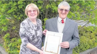  ??  ?? Pictured are Pat and Harry Cook, who have transforme­d the Forest Road Green Belt, with their High Sheriff Award for outstandin­g service to the community.