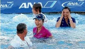  ??  ?? Lydia Ko, then caddie Jason Hamilton, her sister Sura and mother Tina Hyon after leaping into Poppie’s Pond when she won the ANA Inspiratio­n in California in April.