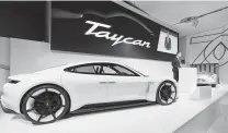  ?? Joerg Eberl / Associated Press ?? Porsche’s electric Taycan, which begins shipping next year, will go from zero to 60 in under 3.5 seconds with a 310-mile range.