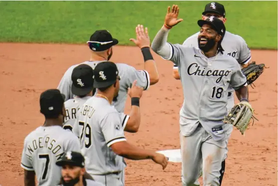  ?? JULIO CORTEZ/AP ?? Outfielder Brian Goodwin (18) celebrates with his teammates after the Sox’ victory Saturday against the Orioles. He had four hits, including a home run.