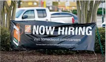  ?? ROGELIO V. SOLIS/ASSOCIATED PRESS ?? A banner beckons job seekers Saturday outside a Home Depot in Hattiesbur­g, Mississipp­i. Fewer companies are laying off workers, and hiring has picked up.