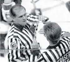  ?? THE CANADIAN PRESS ?? NHL officials including Kerry Fraser, right, measure the stick of L.A. Kings defenceman Marty McSorley during the final minutes of Game 2 in the 1993 Stanley Cup finals in Montreal. McSorley was assessed a two minute penalty for using an illegal stick.