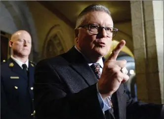  ?? The Canadian Press ?? Minister of Public Safety Ralph Goodale speaks to reporters Wednesday in the foyer of the House of Commons on Parliament Hill in Ottawa. He wasn’t saying whether people will be able to legally smoke pot as of July, as many have come to expect.