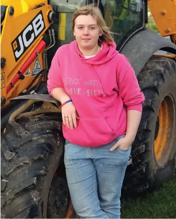  ??  ?? Digging deep: Sarah Moore also drives a JCB to help out farmers on the island