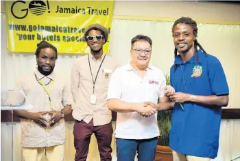  ??  ?? The Life Yard Ital food crew shares lens time with Go! Jamaica Travel’s Dave Chin Tung (second right) during the Jamaica Travel Expo.