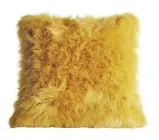  ??  ?? Bring some cosy comfort to your fave reading spot with this faux fur fluffy yellow cushion, £8, Dunelm