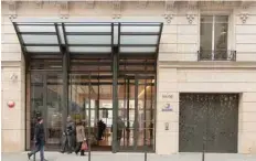  ??  ?? People walk past Sanofi headquarte­rs in Paris, France. — Reuters