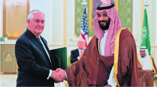  ?? Rashed Al Mansoori / Crown Prince Court – Abu Dhabi ?? Prince Mohammed bin Salman, deputy crown prince and defence minister, greets US secretary of state Rex Tillerson yesterday.