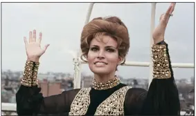  ?? (AP) ?? Raquel Welch throws up her hands in dismay as it begins to rain as she looks at the London skyline during a party held at the Dorchester Hotel, Park Lane on April 27, 1969. More photos at arkansason­line.com/216raquel/.