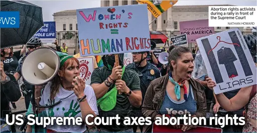  ?? NATHAN HOWARD ?? Abortion rights activists during a rally in front of the Supreme Court