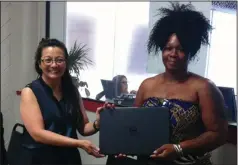  ??  ?? LEFT: Mina Sebastian, left, presents a computer to Ayisha Willaims, a recipient of the 2016 “Live Your Dream” award. RIGHT: Merrin Straw of The Sisterhood and volunteer Ashley Smith Enje.