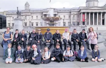  ??  ?? The Palace Fields youngsters at the Trafalgar Square fountain