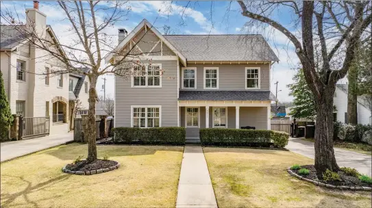  ?? SUBMITTED PHOTOS ?? This four-bedroom, three-and-a-half-bath, two-story home in Little Rock features a classic kitchen, an abundance of windows and a fully fenced backyard.