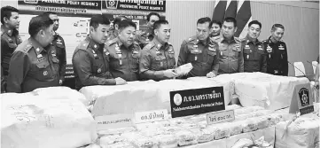  ??  ?? Thai police showing the seized drugs during a press conference in Bangkok. — Bernama photo