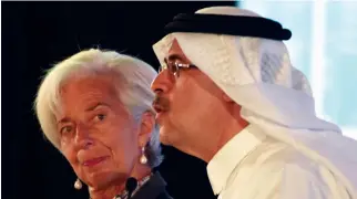  ??  ?? Internatio­nal Monetary Fund Managing Director Christine Lagarde looks at the CEO of Saudi Aramco, Amin Nasser, as he speaks during the Future Investment Initiative conference in Riyadh. (AFP)