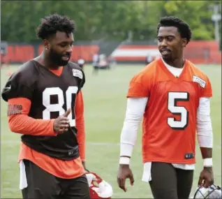  ?? RON SCHWANE — ASSOCIATED PRESS ?? Jarvis Landry, left, and Tyrod Taylor during an OTA June 5 in Berea. The additions of Landry and Taylor are some of the reasons the Browns feel positive as training camp is set to open July 26.