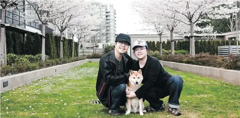  ?? HANDOUT ?? Kevin Leung and his wife, wedding photograph­er Kitty Chan, with their dog.