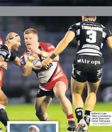  ?? ALEX LIVESEY/GETTY ?? Salford’s Luke Yates is tackled by Jamie Shaul and Carlos Tuimavave