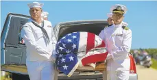  ?? CHRIS ZOELLER/AP FILE PHOTO ?? Navy sailors carry the casket with the remains of Seaman First Class Leon Arickx on July 7 for his burial in Osage, Iowa.