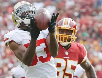  ?? File) (Photo by Alex Brandon, AP ?? San Francisco 49ers cornerback Rashard Robinson (33) intercepts a pass intended for Washington Redskins tight end Vernon Davis (85) during the first half of a game earlier this season.