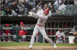  ?? ARMANDO L. SANCHEZ – CHICAGO TRIBUNE/TNS ?? Angels designated hitter Shohei Ohtani drives in a run on a groundout during the third inning against the White Sox on Sunday. Ohtani later left the game with groin tightness.