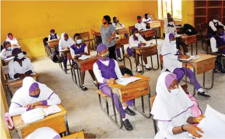  ?? Photo: Felix Onigbinde ?? Students in class at Senior Government Secondary School Wuse in Abuja yesterday, after the seven-months shutdown due to the Covid-19 pandemic