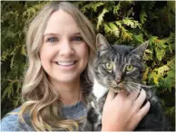  ?? CITIZEN PHOTO BY BRENT BRAATEN ?? Nicole Crandell holds her cat, Biggie, who was shot with pellets.