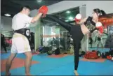  ?? PROVIDED TO CHINA DAILY ?? A woman trains in Thai boxing at a kungfu school in Qingdao, Shandong province.