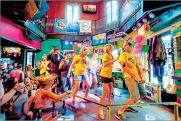  ?? DAVID PUNCH VIA THE NEW YORK TIMES ?? The Cats Meow, a sprawling two-level karaoke bar in New Orleans. A karaoke enthusiast turns a road trip from Brooklyn to Los Angeles into a tour of karaoke bars along the way.