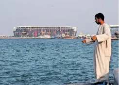  ?? ?? A PICTURE shows a view of the 974 Stadium, which will host matches during the Soccer World Cup 2022, in the Ras Abu Aboud district of the Qatari capital Doha. The World Cup, beginning on November 20, has been marred by controvers­y since Qatar was awarded the tournament 12 years ago. | AFP
