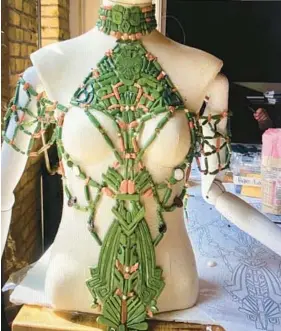  ?? RUTH E. CARTER ?? Dutch designer Iris van Herpen made Shuri’s neckpiece, inspired by Mayan vases of rulers and nobility, in her atelier for the movie “Black Panther: Wakanda Forever.”