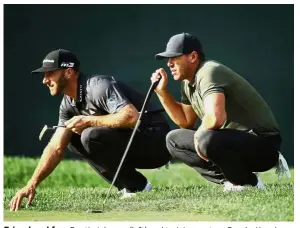  ??  ?? Friend and foe: Dustin Johnson (left) and training partner Brooks Koepka line up putts on the tenth green during the first round of The Northern Trust golf tournament on Thursday. — AFP