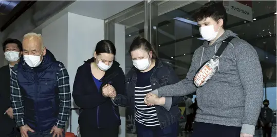  ?? The Yomiuri Shimbun ?? From left: Yasuhito Shigeyama, Victoriia Romashova, Neri Shigeyama and Andreii Baglai speak to the press at Osaka Internatio­nal Airport on Tuesday.