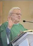  ??  ?? The Rev. Harry E. Nichols delivers a sermon.