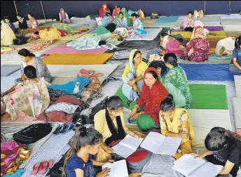  ?? NITIN KANOTRA/HT ?? Families affected from crossborde­r firing take shelter at a relief camp near Vijaypur, about 25km from Jammu, on Wednesday.