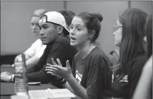  ?? The Associated Press ?? STUDENT COORDINATO­R: Casey Sherman, center, 17, lead student coordinato­r for the Parkland march, speaks on March 14 during a planning meeting with Marjory Stoneman Douglas High School students, parents and volunteers in a hotel meeting room in Coral...