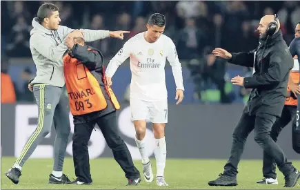  ?? EPA ?? I JUST WANT TO SAY HI: Fans have been known to try and mob Cristiano Ronaldo at training and during matches.