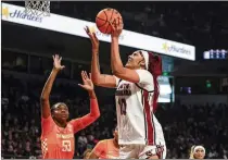  ?? NELL REDMOND/ASSOCIATED PRESS ?? Center Kamilla Cardoso, playing in front of her mom and sister, who had flown in from Brazil for Senior Day, led South Carolina to a win over Tennessee. It was the top-ranked Gamecocks’ 47th consecutiv­e SEC regular-season victory.