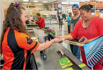  ?? MYTCHALL BRANSGROVE/STUFF ?? Paymark figures show spending was high in areas including hardware sales. Pictured in Mitre 10 Mega Timaru is Ashley Campbell serving Joe and Marie Faaluge.