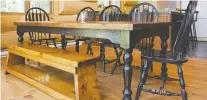  ??  ?? Paquette partially built the dining room set from discarded chairs and table legs his wife told him she had seen abandoned by the roadside.