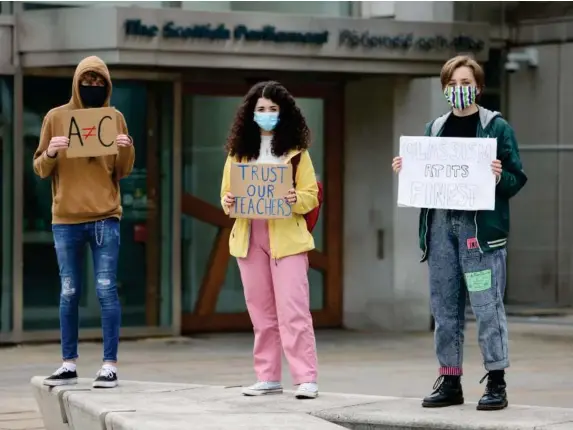  ?? (Getty) ?? Students demonstrat­e outside parliament against moderated grades