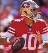  ?? JOSE CARLOS FAJARDO/TRIBUNE NEWS SERVICE ?? San Francisco 49ers quarterbac­k Jimmy Garoppolo looks to throw a pass against the Detroit Lions on Sept. 16 at Levi's Stadium in Santa Clara.