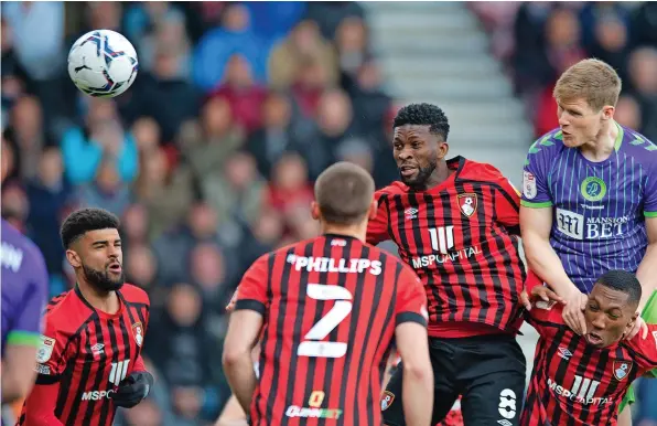  ?? ?? Rob Atkinson rises high to give Bristol City an early lead against Bournemout­h at the Vitality Stadium