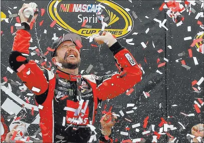  ?? AMBER SEARLS/ USA TODAY ?? Las Vegas’ Kurt Busch can barely control his joy Sunday after winning the NASCAR Sprint Cup Series Toyota Owners 400 at Richmond Internatio­nal Raceway in Richmond, Va. Busch started the season on suspension because of an alleged domestic violence...
