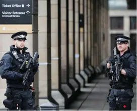  ??  ?? Armed police officers patrol outside Westminste­r undergroun­d station the morning after the attack