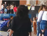  ?? TERRENCE ANTONIO JAMES/CHICAGO TRIBUNE VIA AP ?? Migrants living in the Chicago Police Department Ogden District station are seen July 7 in Chicago.