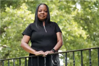  ?? AP PHOTO/MICHAEL PEREZ ?? Philadelph­ia school district teacher Rhonda Hicks poses for a July 20 portrait at her home in Philadelph­ia.