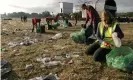  ??  ?? Volunteers collect rubbish from the festival site. Photograph: Alamy